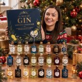 24 Day Of GIN 2026 Advent Calendar 1 Woman smiling behind a 24 Days of Gin Advent Calendar by TheStripedcat