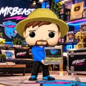 MrBeast collectible figure with straw hat and cash case