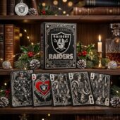 Las Vegas Raiders Playing Card Box Set 4 Las Vegas Raiders themed playing cards and display box on a wooden shelf