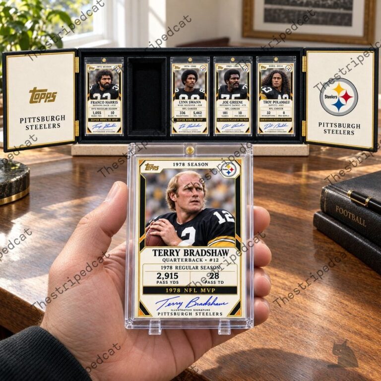 Hand holding a Terry Bradshaw graded Topps football card in front of a Pittsburgh Steelers collectible display case
