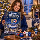Woman holding a Toronto Blue Jays 50th Anniversary 2026 advent calendar.