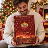 Man holding an AS Roma advent calendar in front of a Christmas tree