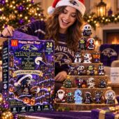 Woman in Ravens sweater with Baltimore Ravens and Nightmare Before Christmas holiday advent calendar
