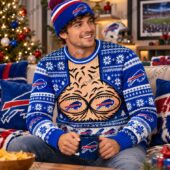 Buffalo Bills Merch Hairy Chest Ugly Christmas Sweater 1 Man wearing Buffalo Bills holiday sweater and matching beanie holding team mug