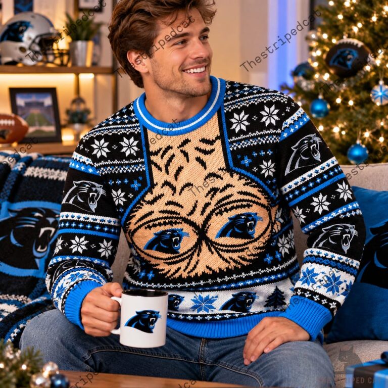 Man wearing a Carolina Panthers festive holiday sweater with team logos and patterns.