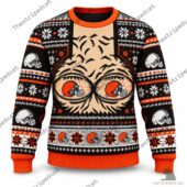 Horror-themed knit sweater featuring a creepy character face, skulls, and festive patterns from TheStripedcat