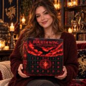 Woman holding a 2026 Fourth Wing dragon-themed advent calendar