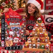 Woman holding Georgia Bulldogs Snoopy Christmas Advent Calendar collector set from TheStripedcat
