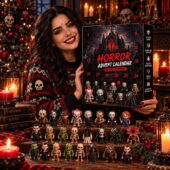 Woman holding a 24-day horror-themed advent calendar with miniature movie monster figurines.