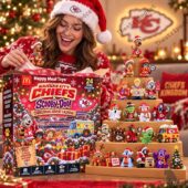 Woman opening a Kansas City Chiefs Scooby-Doo Christmas advent calendar featuring 24 collectible figures from TheStripedcat.