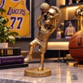 Gold-colored Luka Doncic basketball statue wearing a Los Angeles Lakers jersey