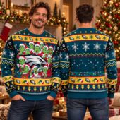 Man modeling a teal Philadelphia Eagles Grinch themed holiday sweater