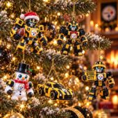 Pittsburgh Steelers x Transformers Christmas Advent Calendar 2026 2 Pittsburgh Steelers robot and car ornaments hanging on a Christmas tree