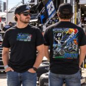 Man wearing a black Chase Dietz 23 National Open winner t-shirt at a racetrack