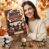 Woman holding 2026 Snoopy Halloween advent calendar from TheStripedcat