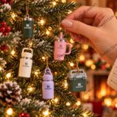 Miniature Stanley cup ornaments hanging on a Christmas tree from TheStripedcat