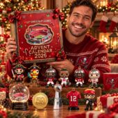 Man holding a Tampa Bay Buccaneers 2026 Advent Calendar with holiday collectibles