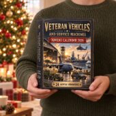 Person holding a 2026 Veteran Vehicles and Service Machines advent calendar containing 24 acrylic ornaments.